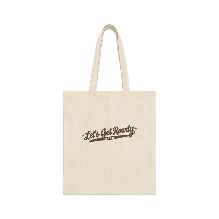 A natural canvas tote bag with brown text reading Let's Get Rowdy BACH.