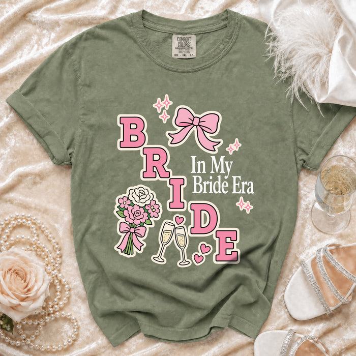 Green t-shirt with "BRIDE In My Bride Era" graphic featuring pink lettering and accents.