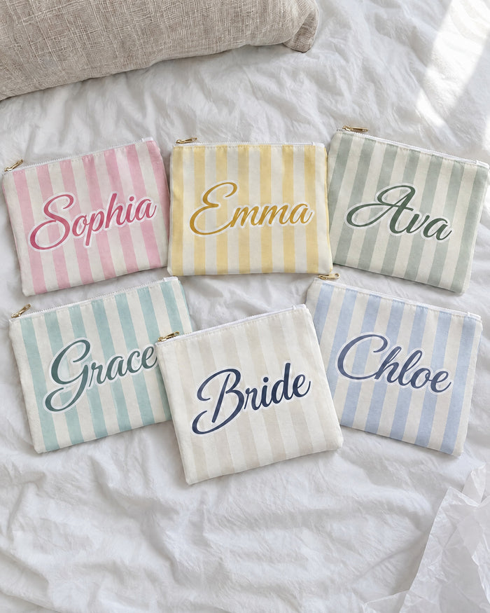 Personalised Last Toast On The Coast name pouches in mixed stripe colours with the Bride pouch