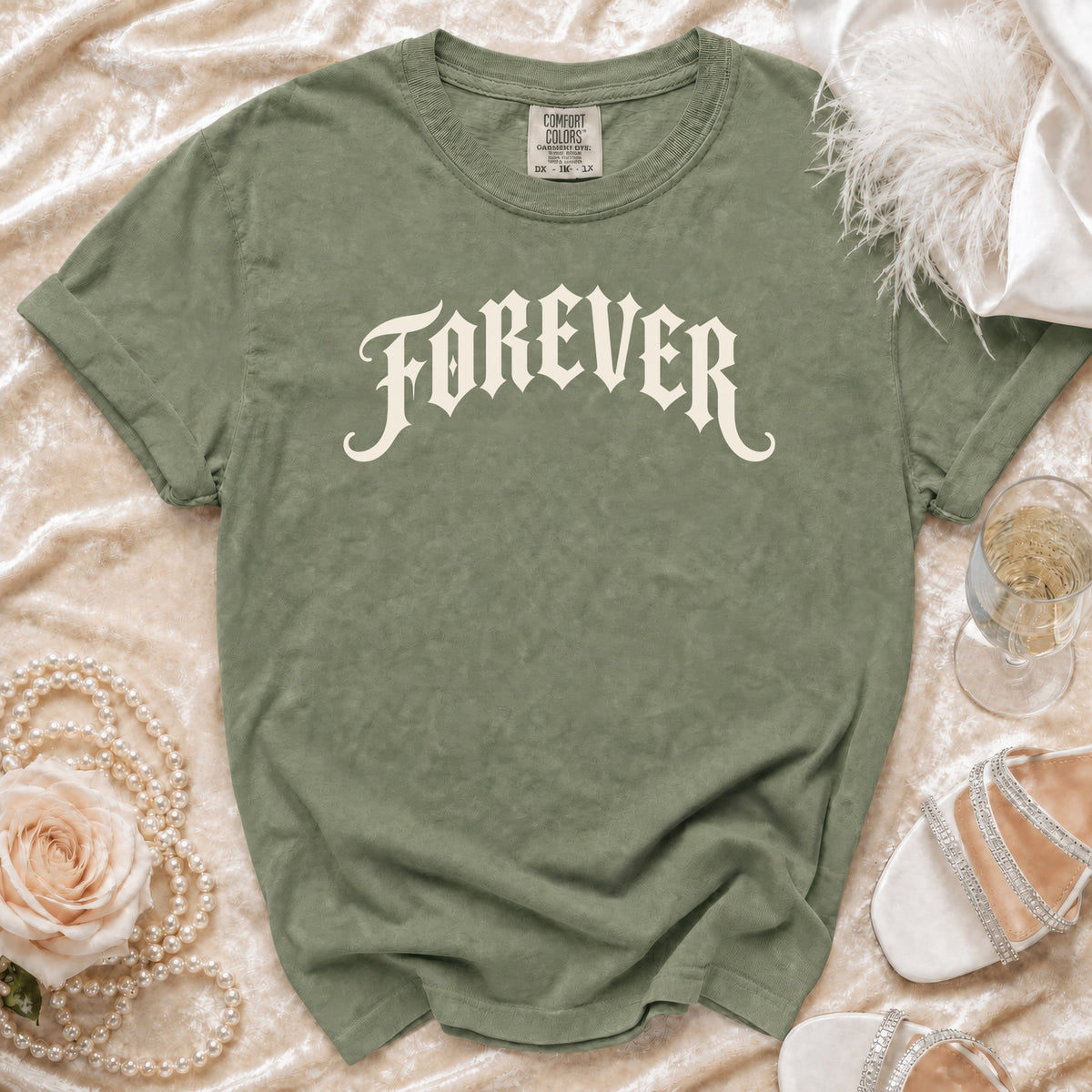 Olive green t-shirt with "FOREVER" in gothic font, Comfort Colors tag visible.