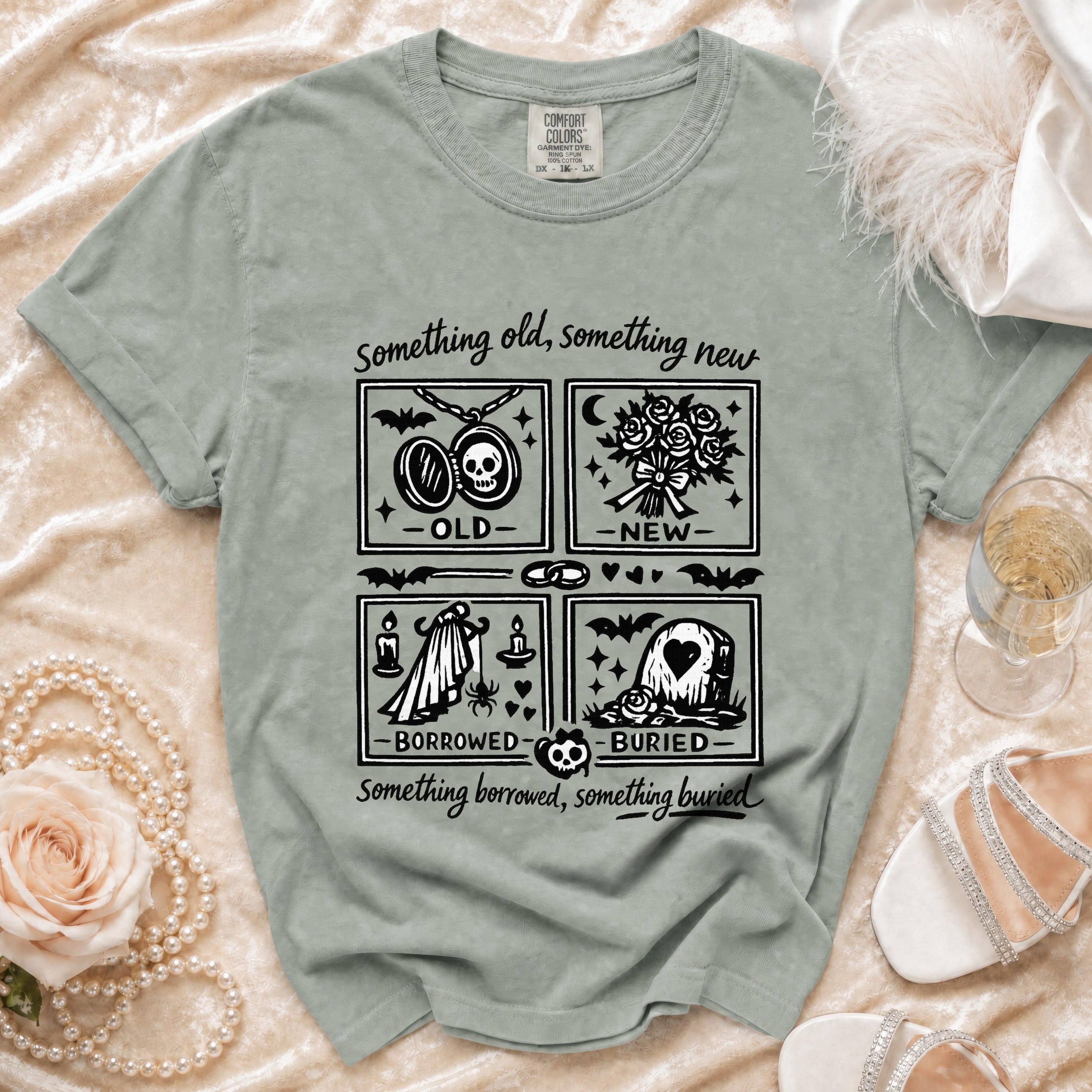 T-shirt with "something old, something new, borrowed, buried" text and illustrations.