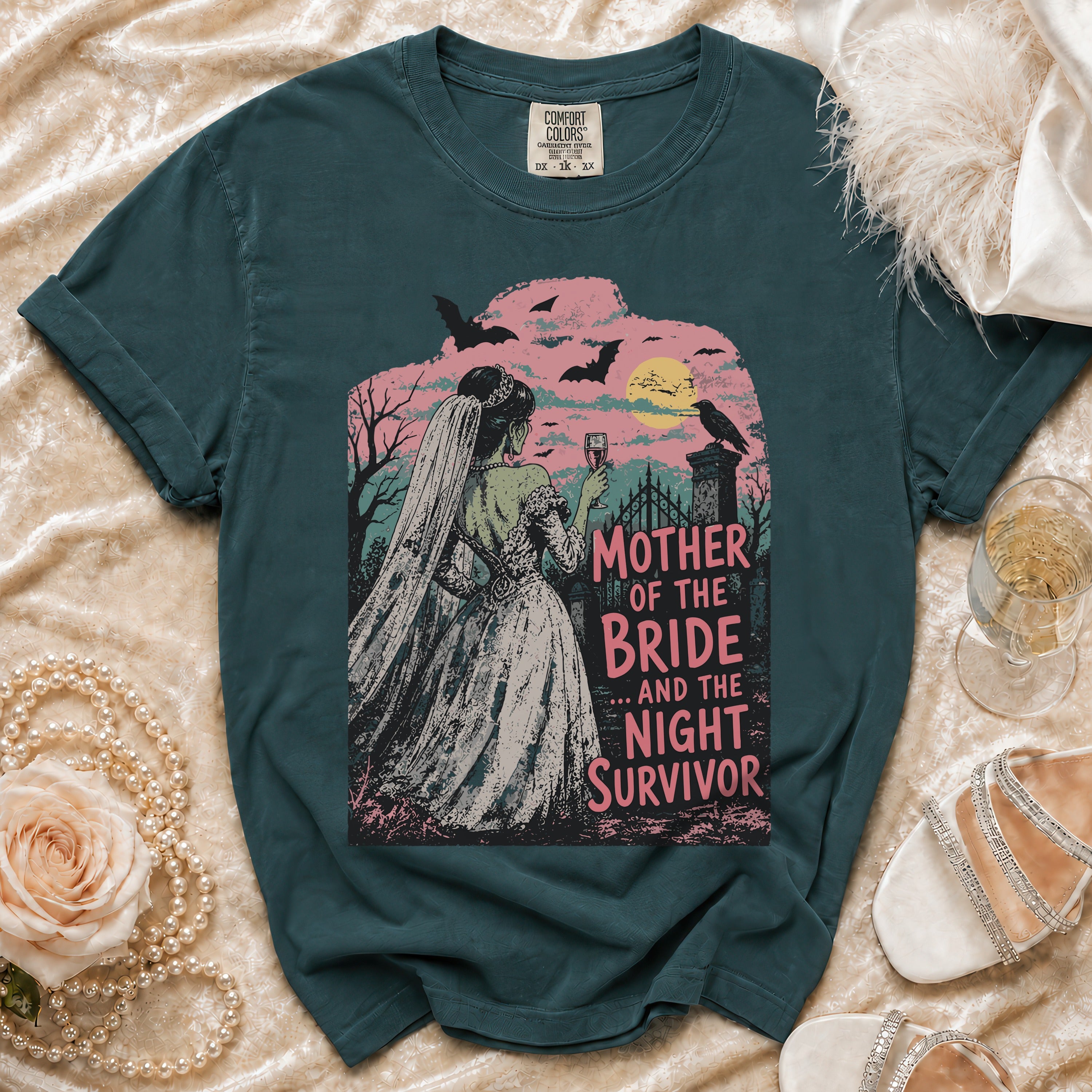 Dark teal t-shirt with "Mother of the Bride... And the Night Survivor" text and gothic bride graphic.