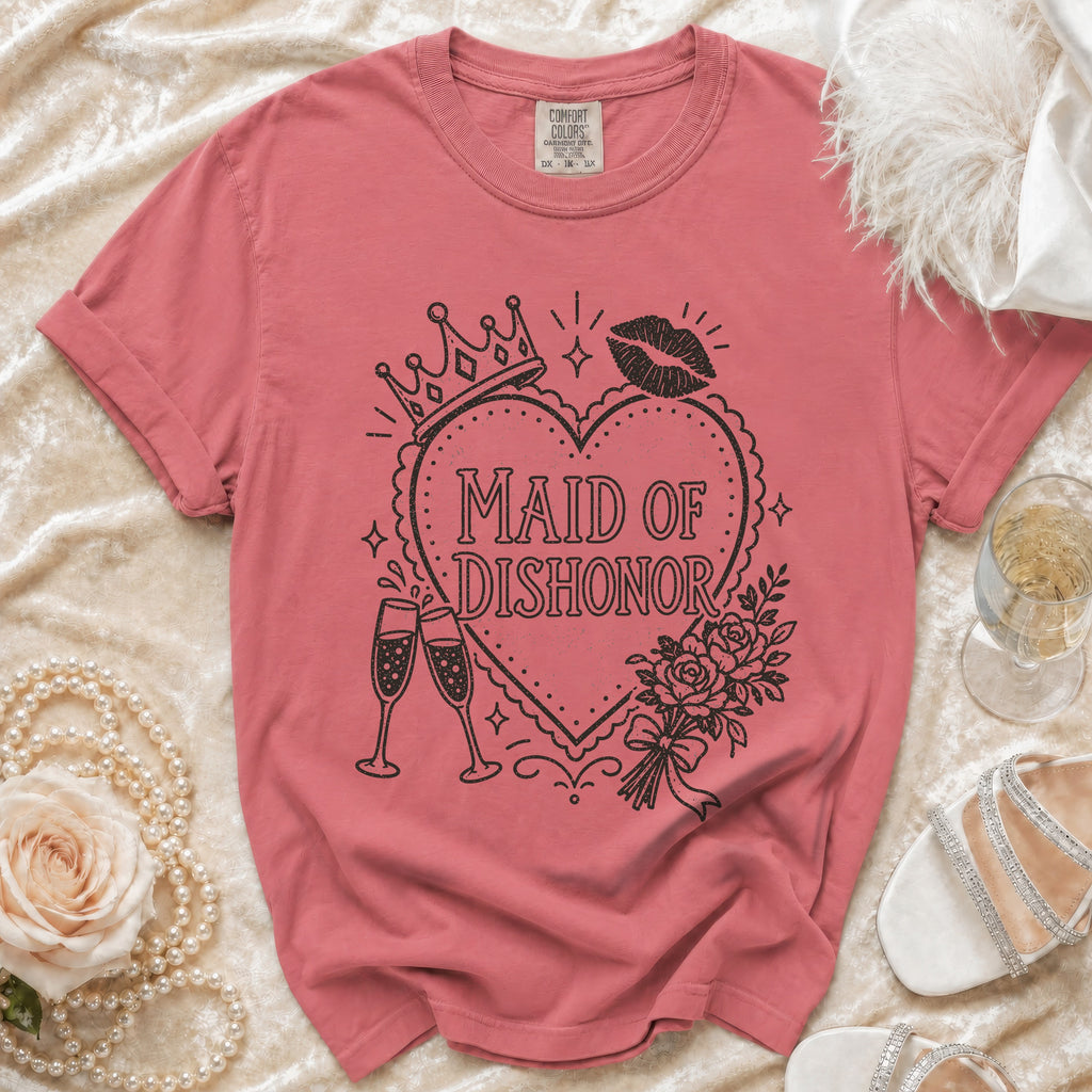 Pink t-shirt with "Maid of Dishonor" text and graphic designs.
