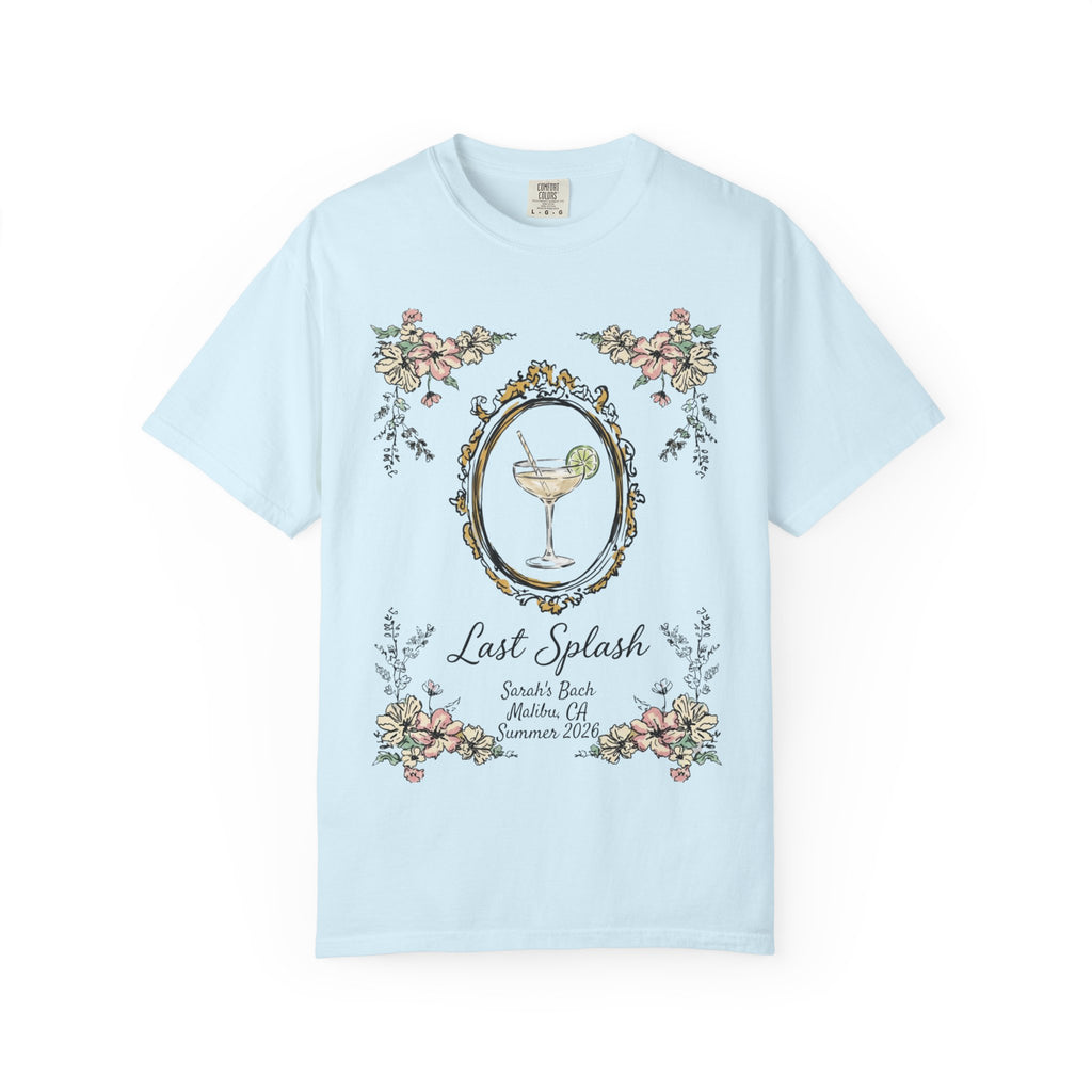 Light blue t-shirt with a cocktail and floral border, reading "Last Splash" and event details.