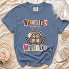 Blue t-shirt with "MARRIED my favorite WEIRDO" text and cartoon raccoons.