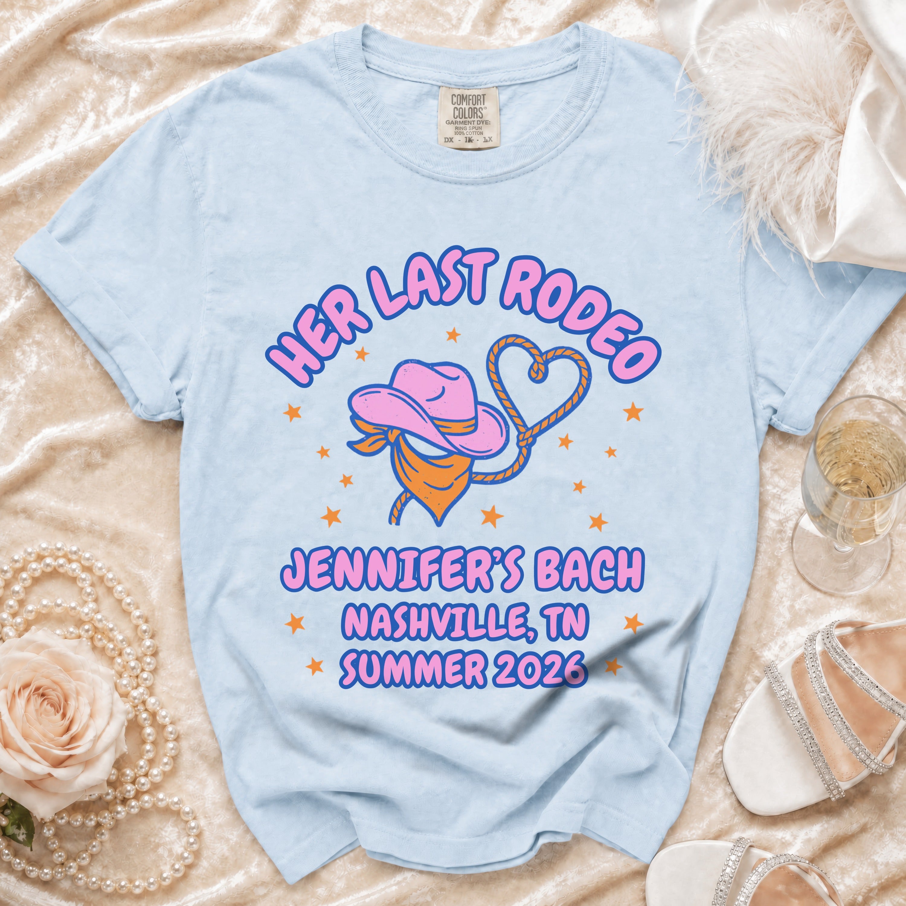 Light blue t-shirt with "Her Last Rodeo Jennifer's Bach Nashville, TN Summer 2026" text.