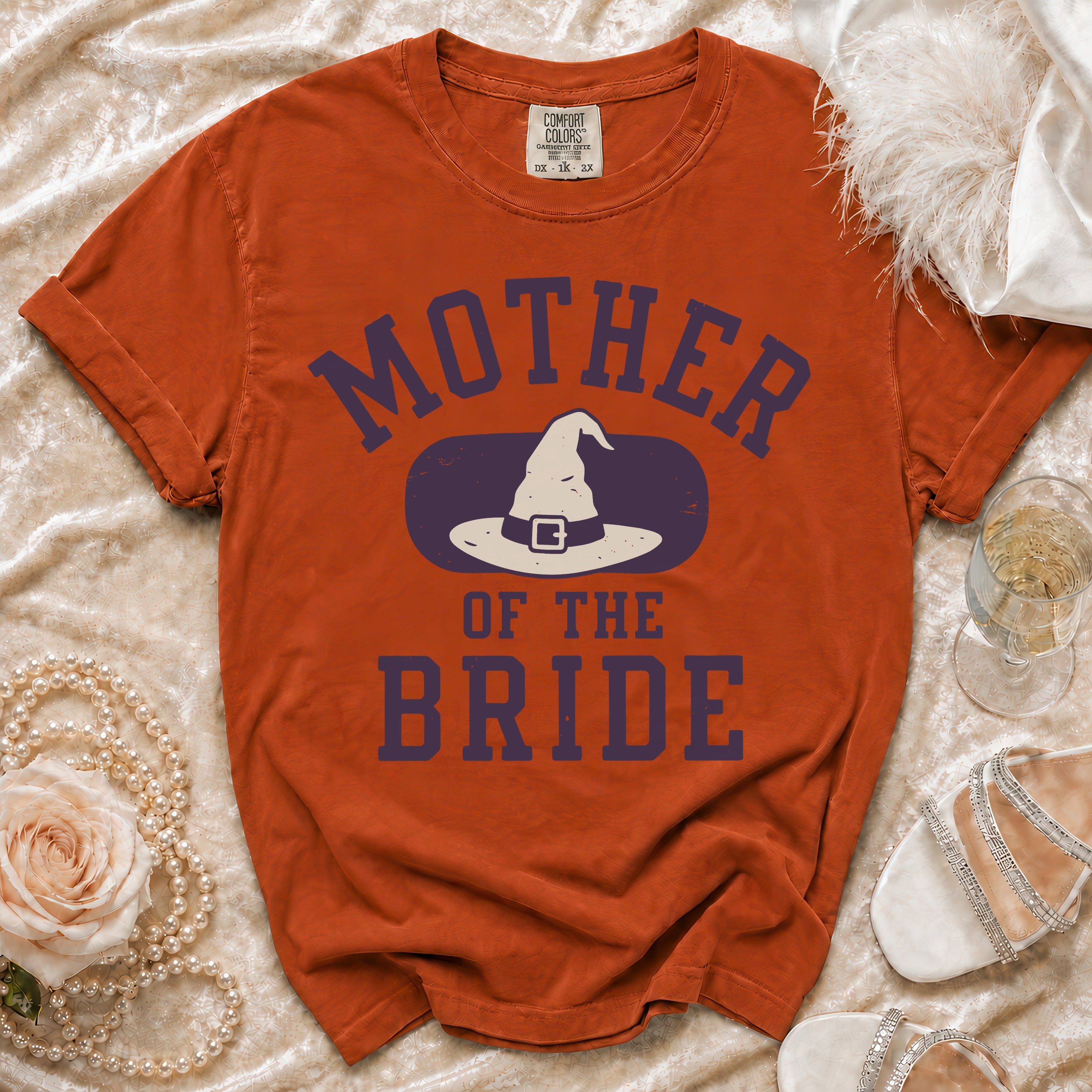 Orange t-shirt with "Mother of the Bride" and witch hat graphic.