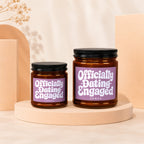 Two candles labeled "Officially Dating Engaged" are displayed on pedestals.