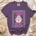 Purple t-shirt with "Spooky Bride" ghost graphic featuring a veil and bouquet.