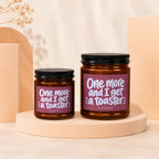 Two brown glass jars with black lids, featuring pink labels with white text.