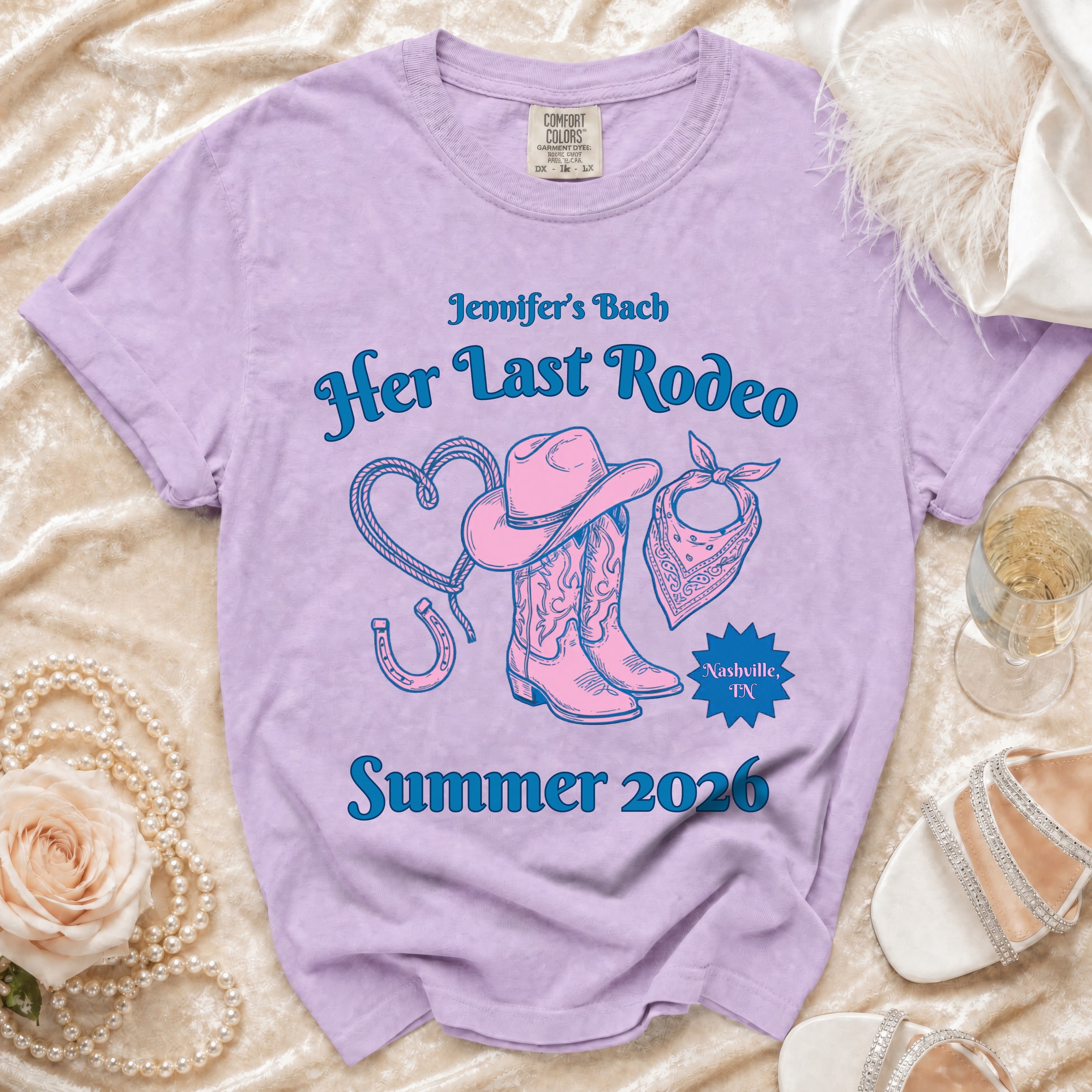 Purple t-shirt with "Her Last Rodeo" and western graphics for Summer 2026.