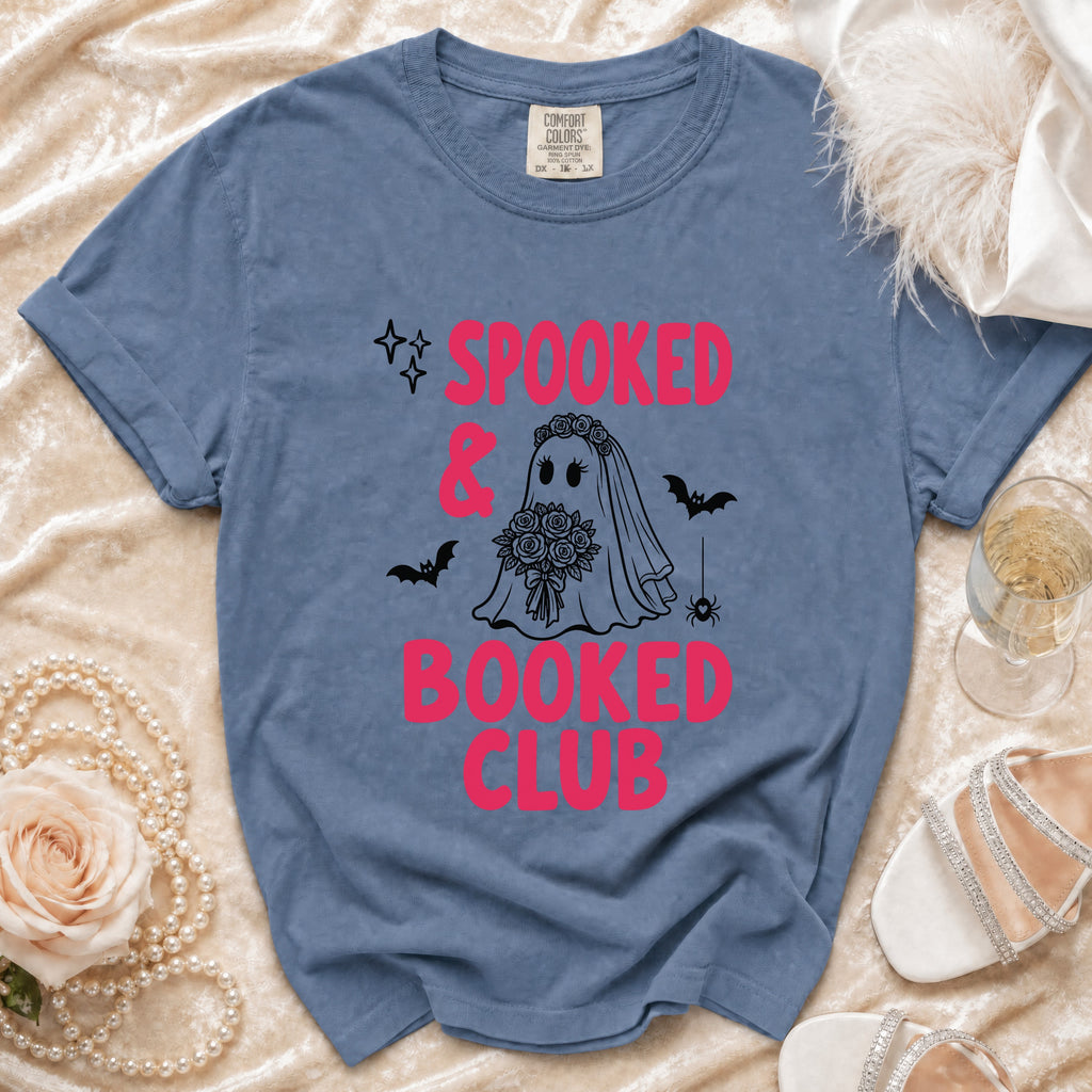 Blue t-shirt with "Spooked & Booked Club" text and ghost bride graphic.