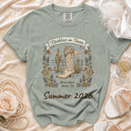 T-shirt graphic with cowboy boot, disco ball, cacti, and text "Reckless in Texas, Olivia's Bach Austin, TX Summer 2026".