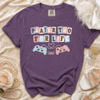 Purple t-shirt with "PLAYER TWO FOR LIFE" text and gaming controllers.