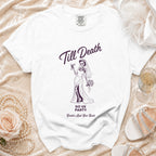 White t-shirt with skeleton bride graphic reading "Till Death" and "Bride's Last Boo Bash."