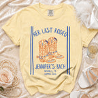 Yellow t-shirt with "Her Last Rodeo" and cowboy boots graphic.