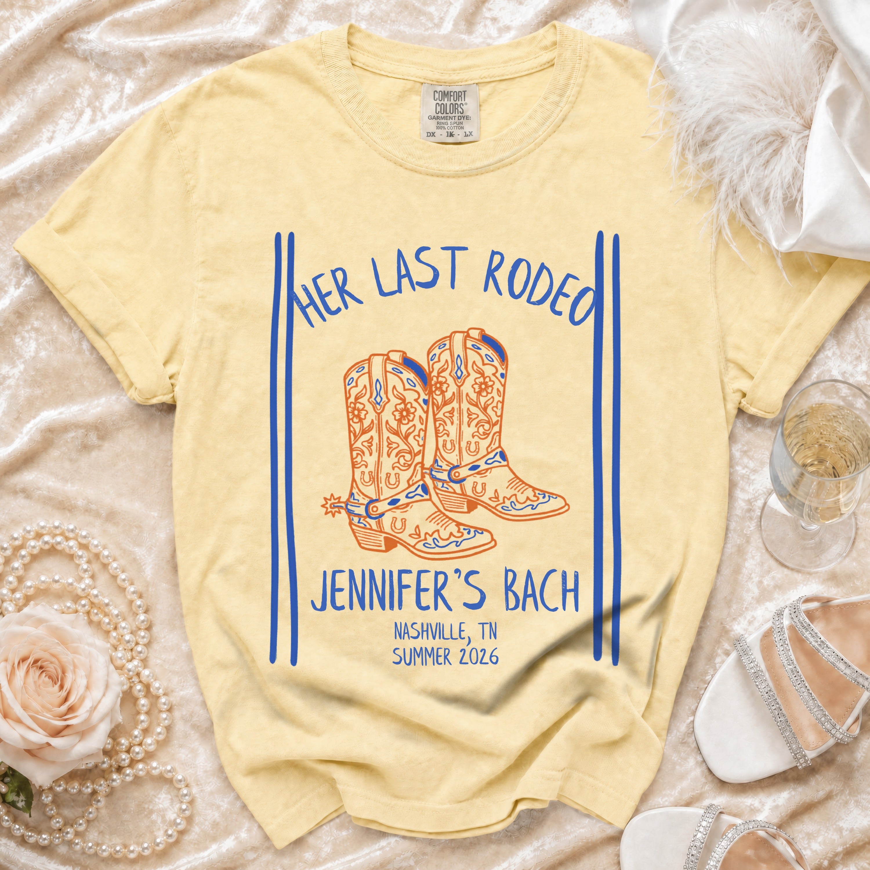 Yellow t-shirt with "Her Last Rodeo" and cowboy boots graphic.