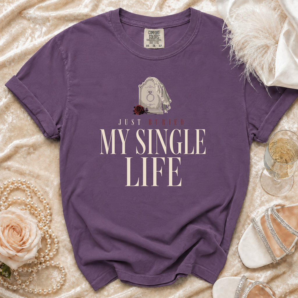 Purple t-shirt with text "Just Buried My Single Life" and tombstone graphic.