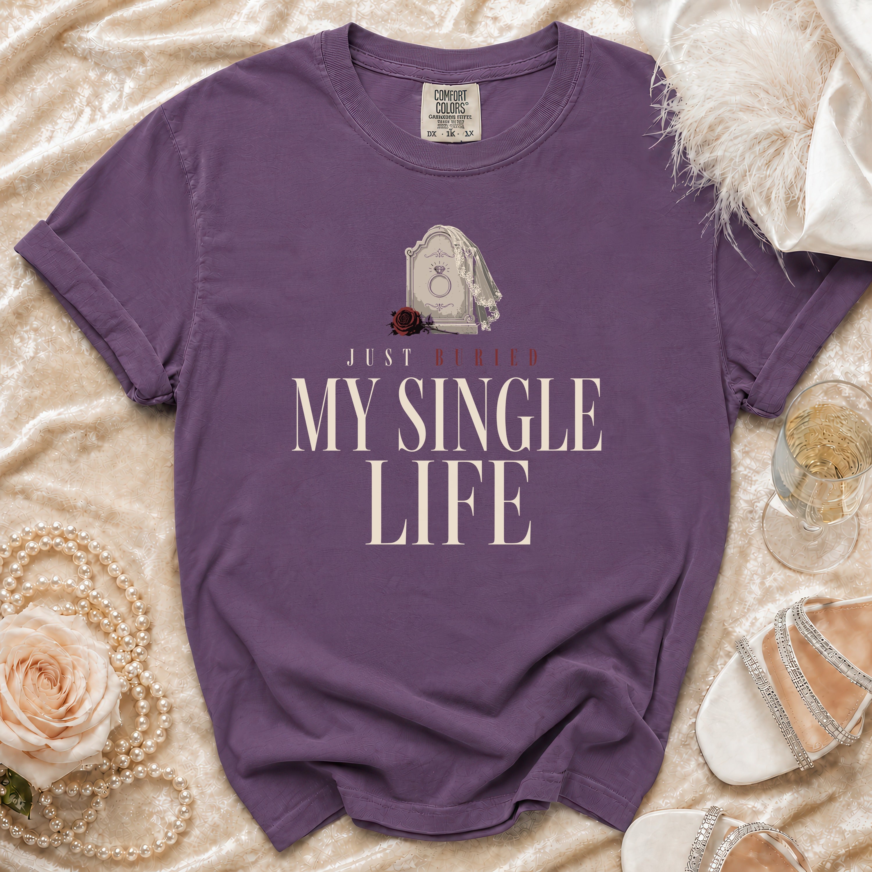 Purple t-shirt with text "Just Buried My Single Life" and tombstone graphic.