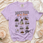 Purple t-shirt with "Mother of the Bride" graphic detailing wedding chaos and survival.