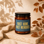 Amber jar candle with blue label reading "First Home, First Memories"
