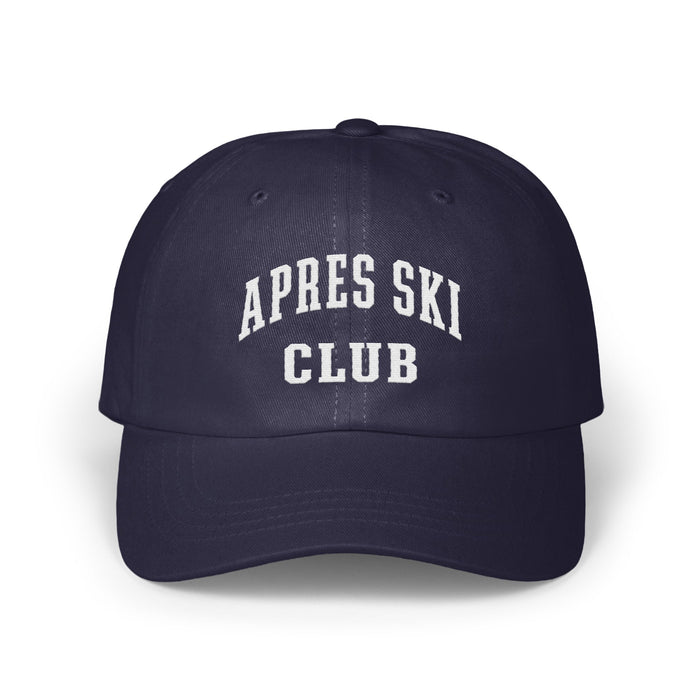 Dark navy blue baseball cap with white embroidered text reading APRES SKI CLUB.