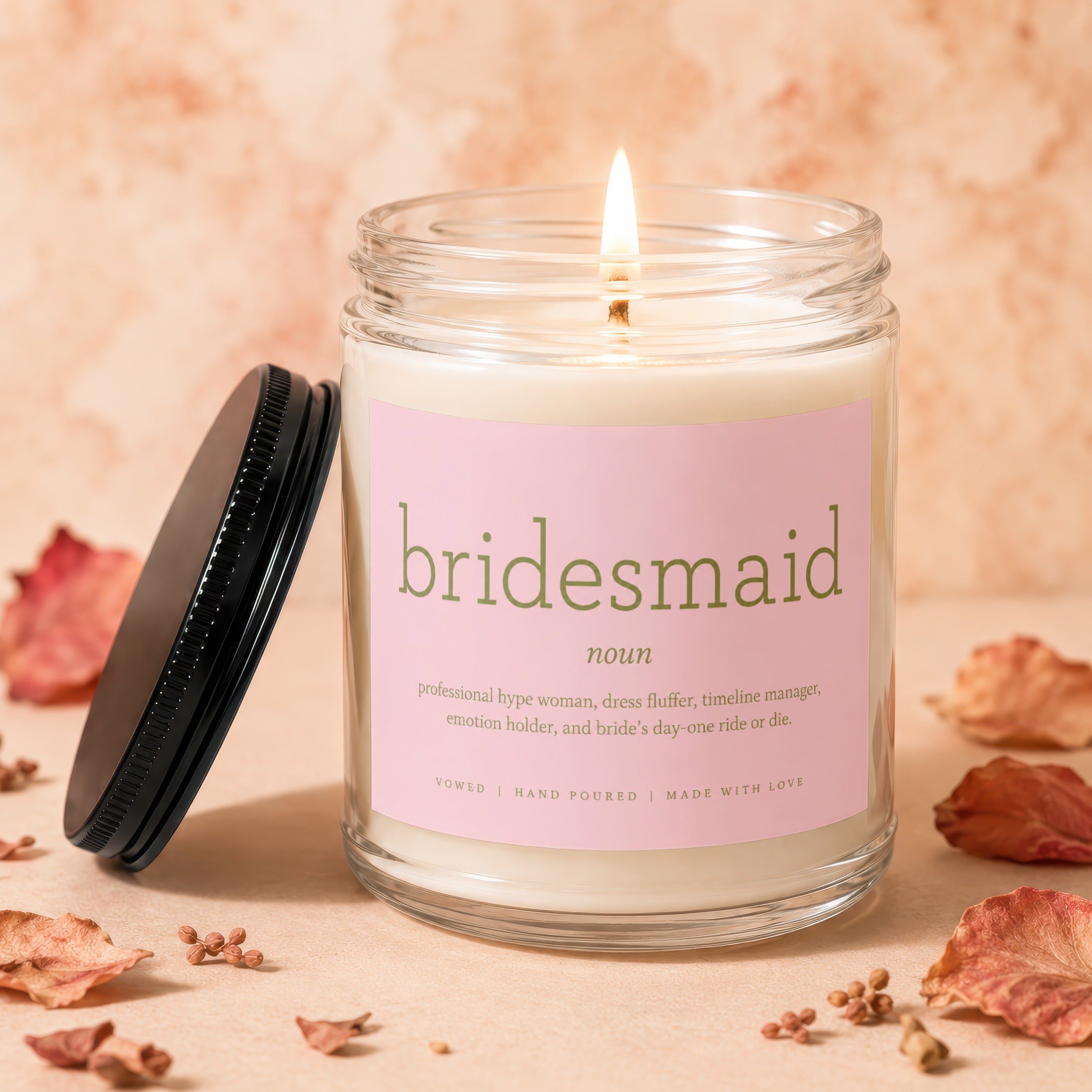 Candle with "bridesmaid" definition label and burning wick.
