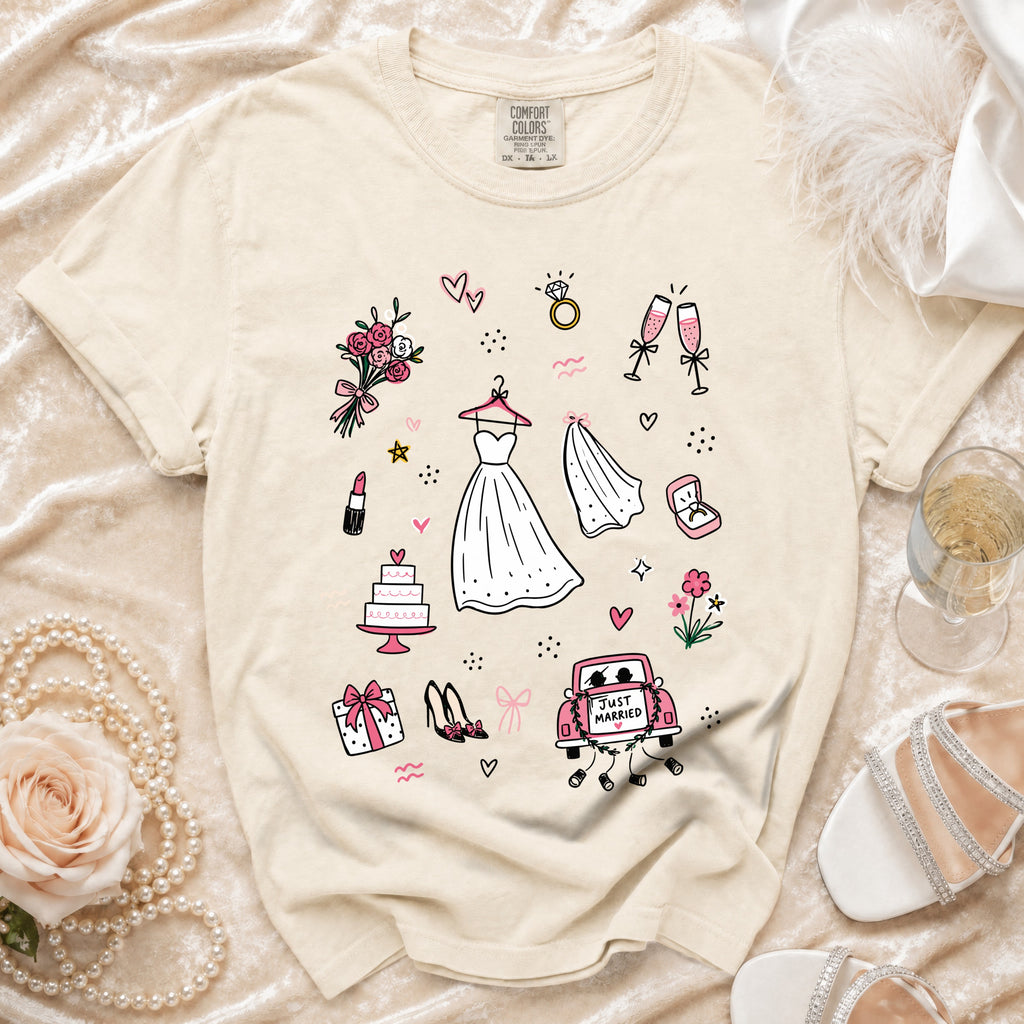 Cream t-shirt with sketched wedding icons: dress, cake, rings, and "Just Married" car.