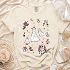 Cream t-shirt with sketched wedding icons: dress, cake, rings, and "Just Married" car.