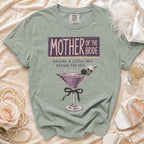 Green t-shirt with "Mother of the Bride Raising a Little Hell Before the Veil" text.