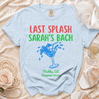 Light blue t-shirt with "Last Splash Sarah's Bach" text and martini glass graphic.