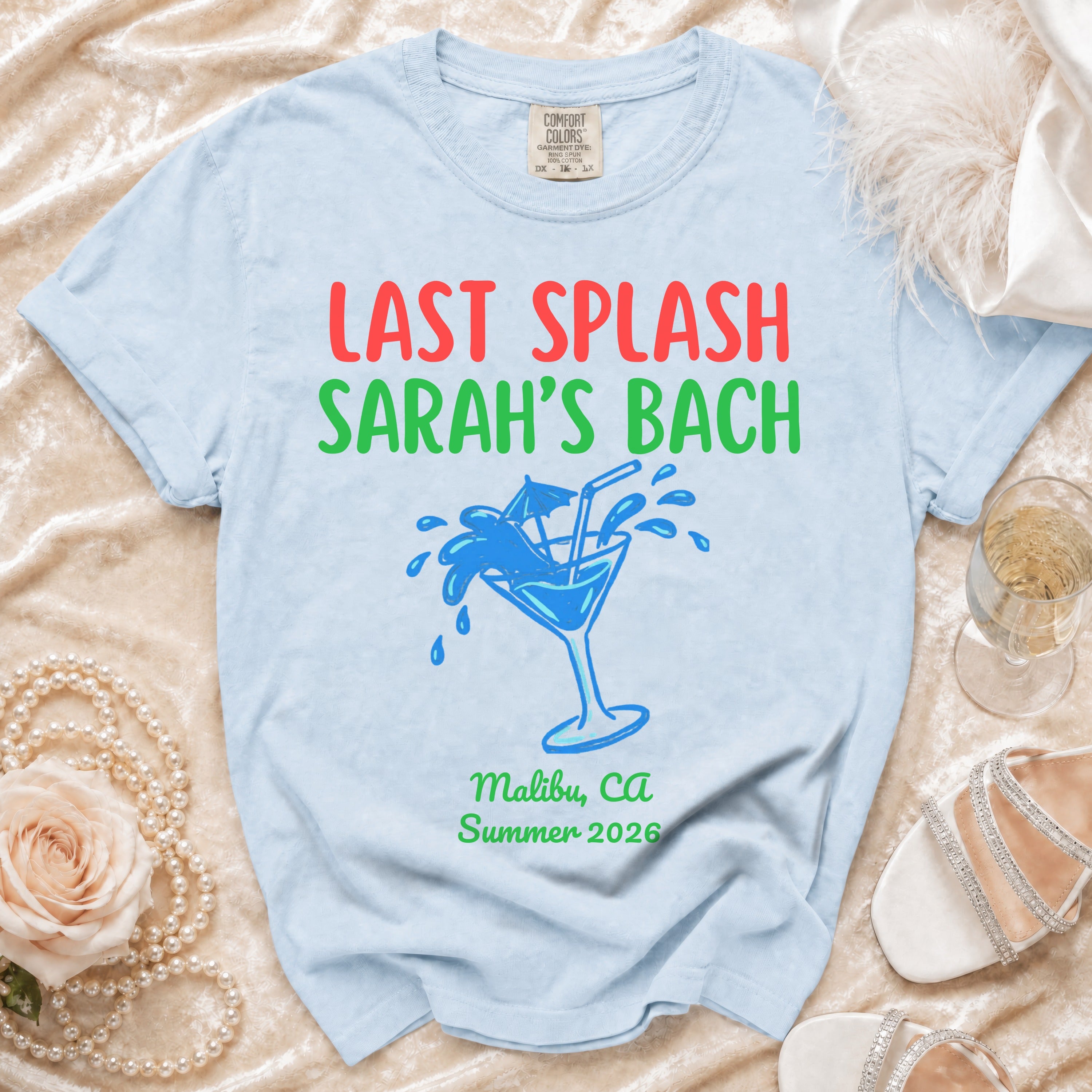 Light blue t-shirt with "Last Splash Sarah's Bach" text and martini glass graphic.