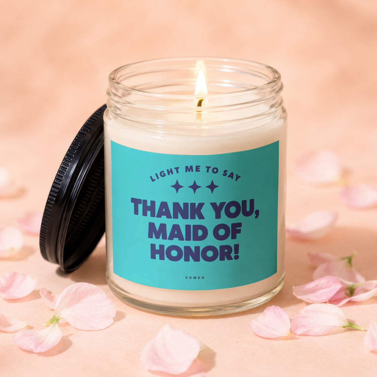 Glass candle with lit wick and "Thank You, Maid of Honor!" text.