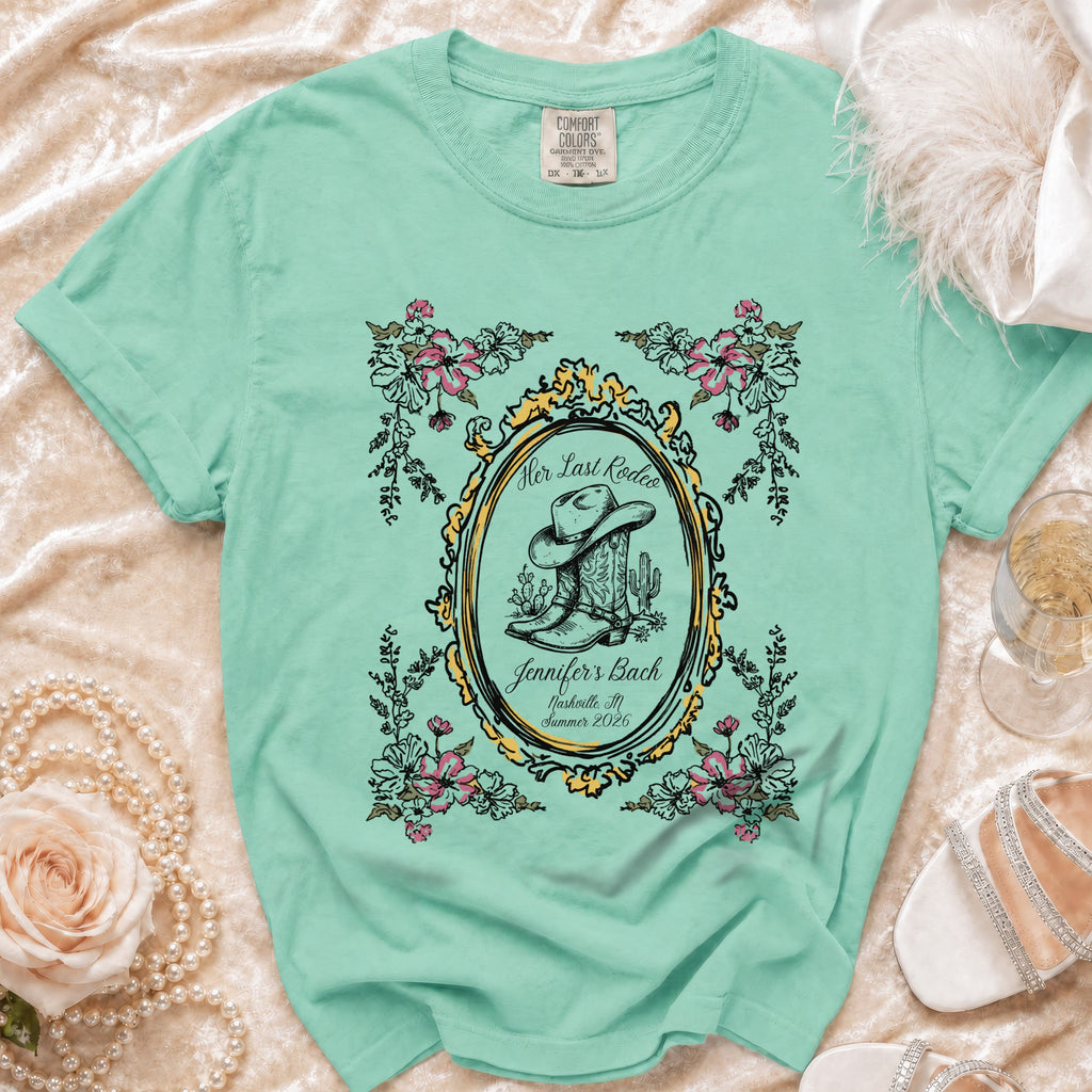 Mint t-shirt with "Her Last Rodeo" design featuring cowboy boots and hat.