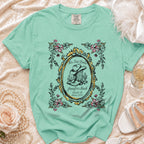 Mint t-shirt with "Her Last Rodeo" design featuring cowboy boots and hat.