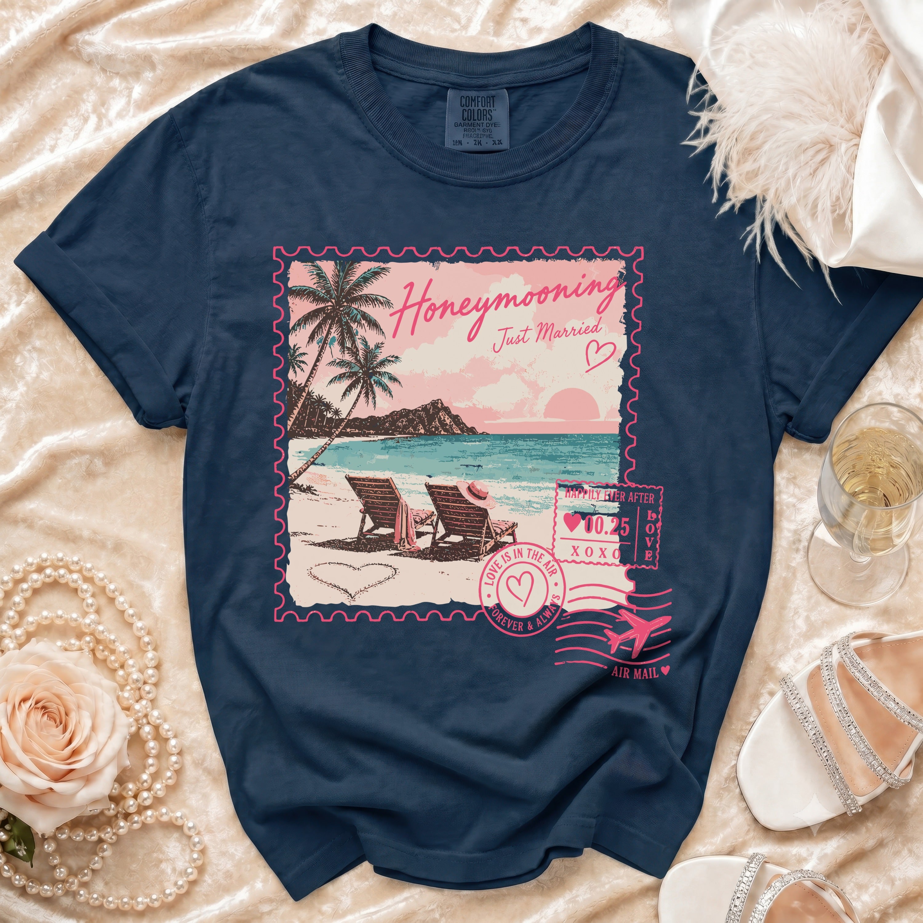 Navy t-shirt with "Honeymooning Just Married" stamp graphic of a beach scene.