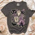 Dark gray t-shirt with Halloween bachelorette graphics including cats, a ghost, a castle, and text.