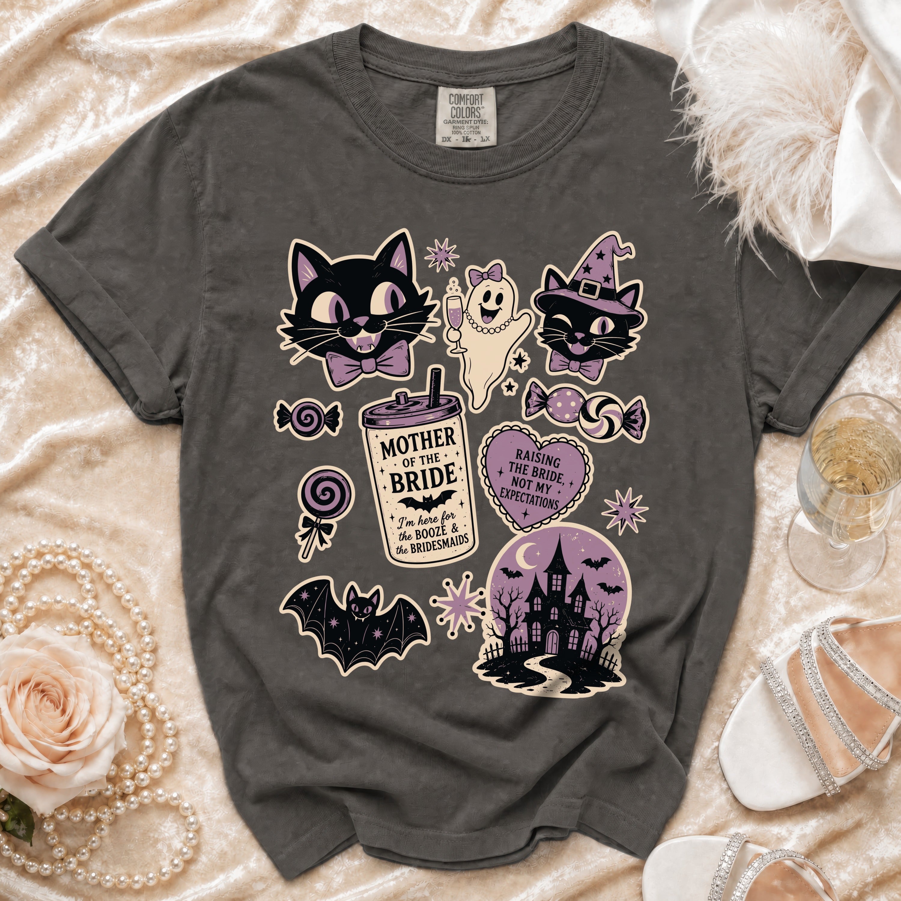 Dark gray t-shirt with Halloween bachelorette graphics including cats, a ghost, a castle, and text.