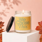 Jar candle with a lit wick, labeled "We Chose This VOWED".