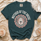 Teal t-shirt with "Mother of the Bride" and a ghost bride graphic.