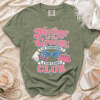 Green t-shirt with "Mother of the Groom Tie Straightener & Tear Catcher Club" text and graphics.