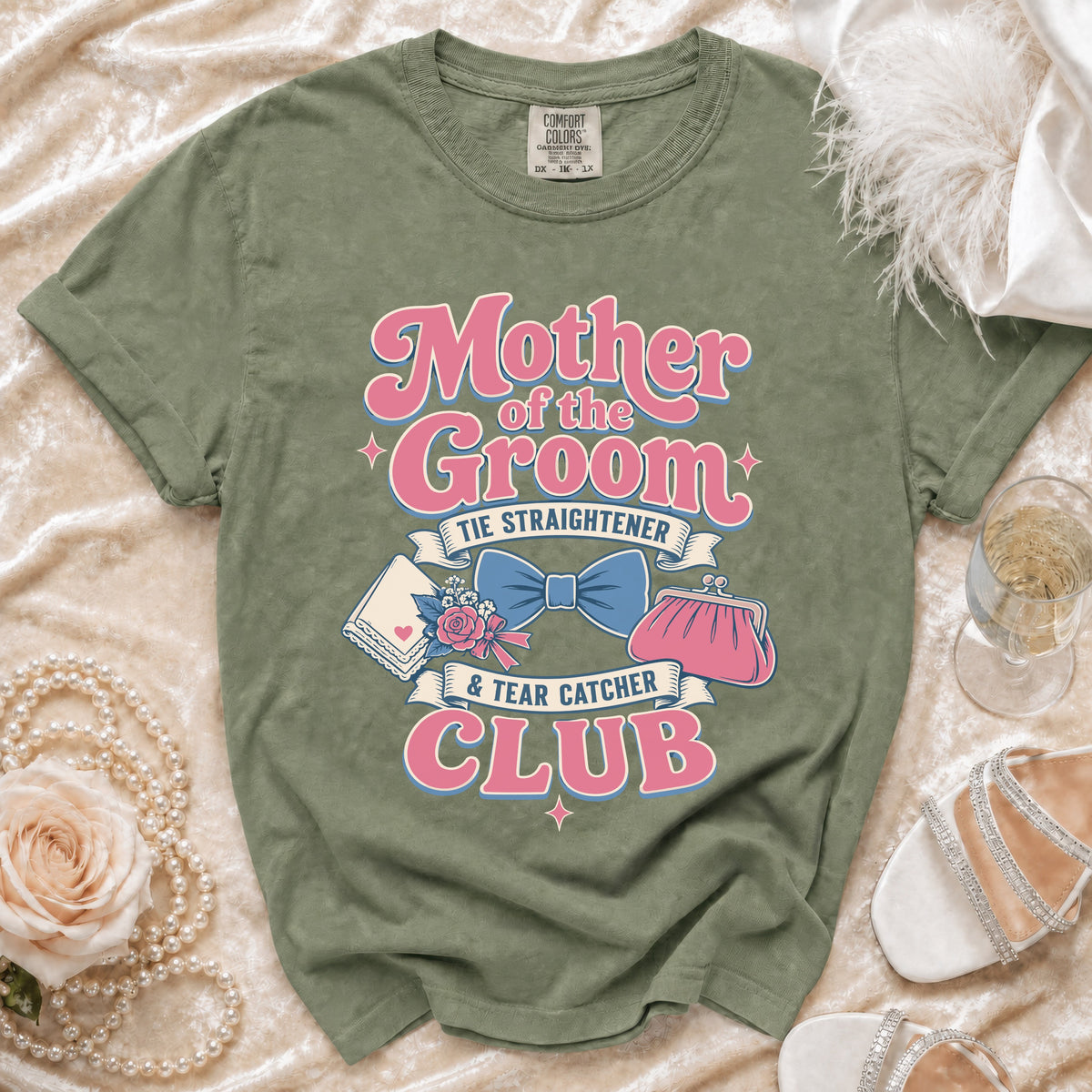 Green t-shirt with "Mother of the Groom Tie Straightener & Tear Catcher Club" text and graphics.