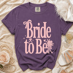 Purple t-shirt with "Bride to Be" and a diamond ring graphic.