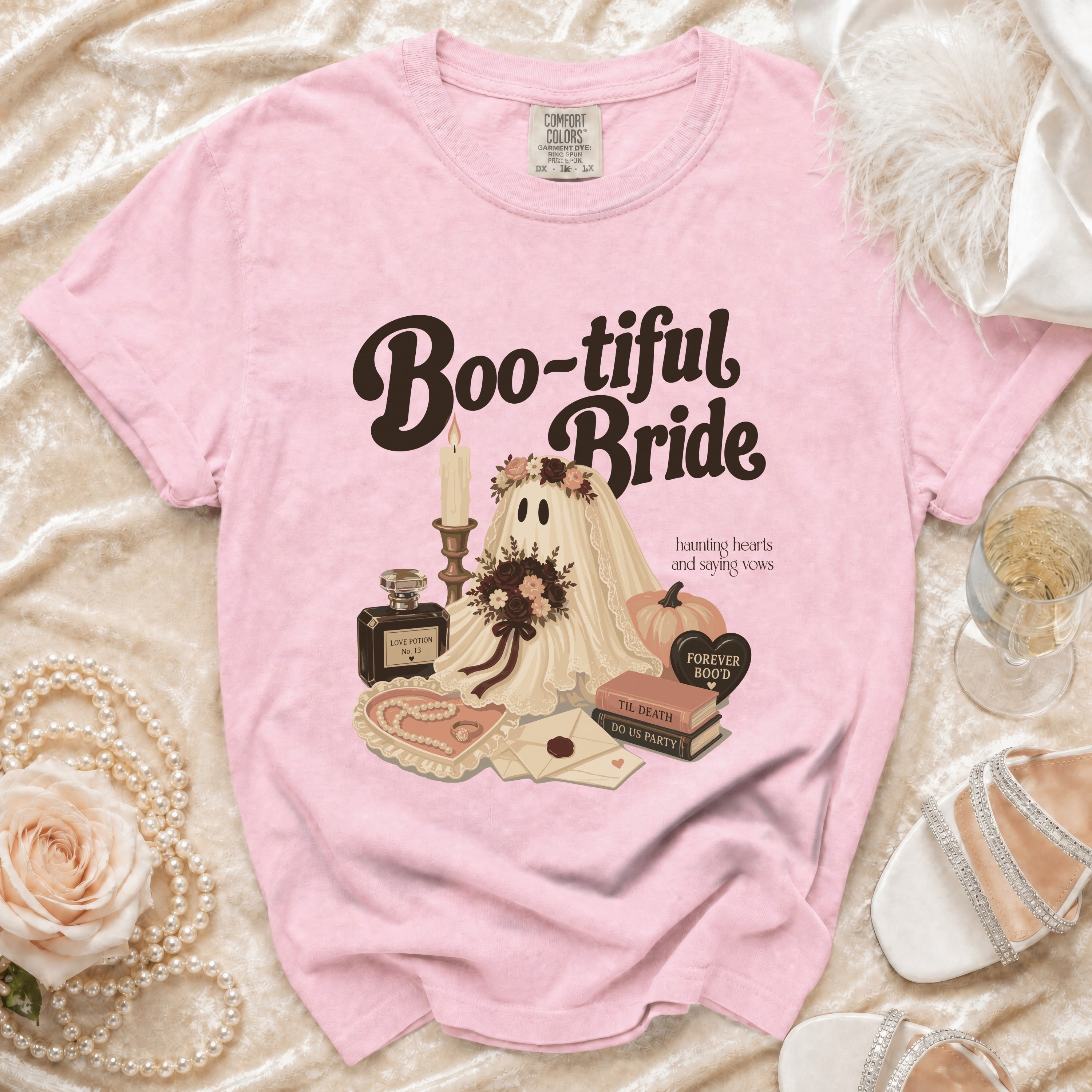 Pink t-shirt with "Boo-tiful Bride" graphic featuring a ghost bride, pumpkin, and books.