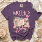 Purple t-shirt with "Mother of the Bride, I Raised the Bride, I Deserve a Vacation" graphic.