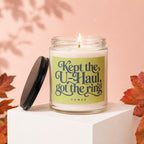 Candle with text "Kept the U-Haul, got the ring" on a light green label.