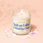 Lit candle in glass jar with "Smells Like Built on Coffee & Wedding Chaos" label.