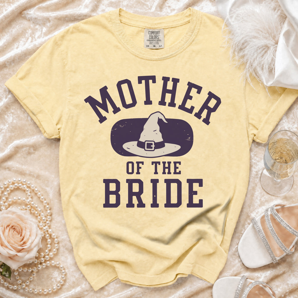 Yellow t-shirt with "Mother of the Bride" and a witch hat graphic.