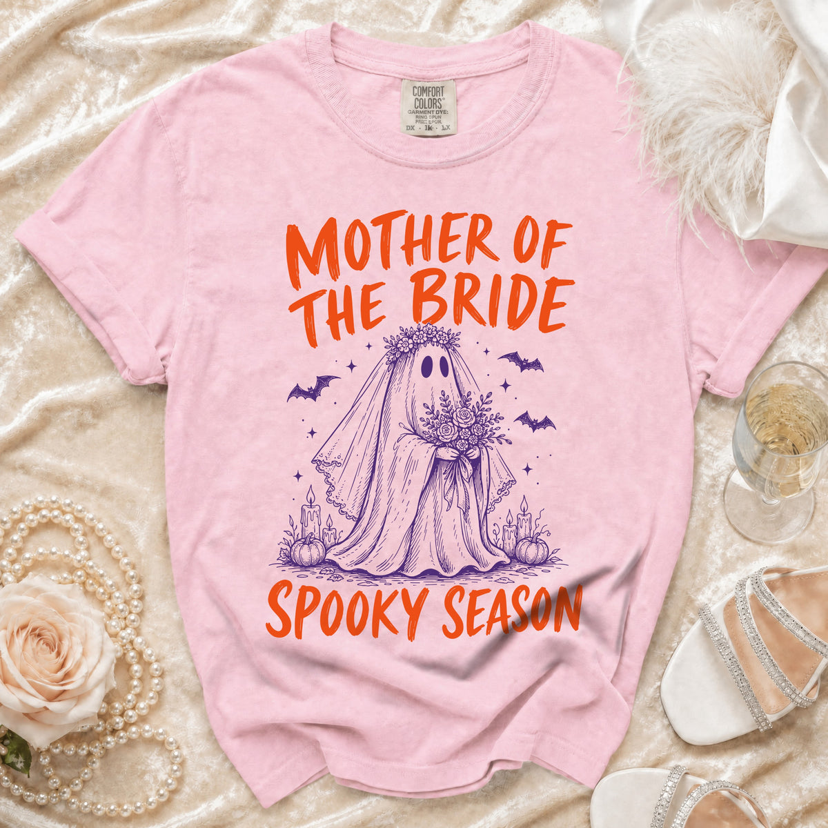 Pink t-shirt with "Mother of the Bride Spooky Season" text and ghost graphic.