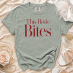 Sage green t-shirt with "This Bride Bites" in red text.